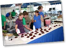Volunteers prepare Cherry Pies for sale at Cherry Festival (circa 2009)